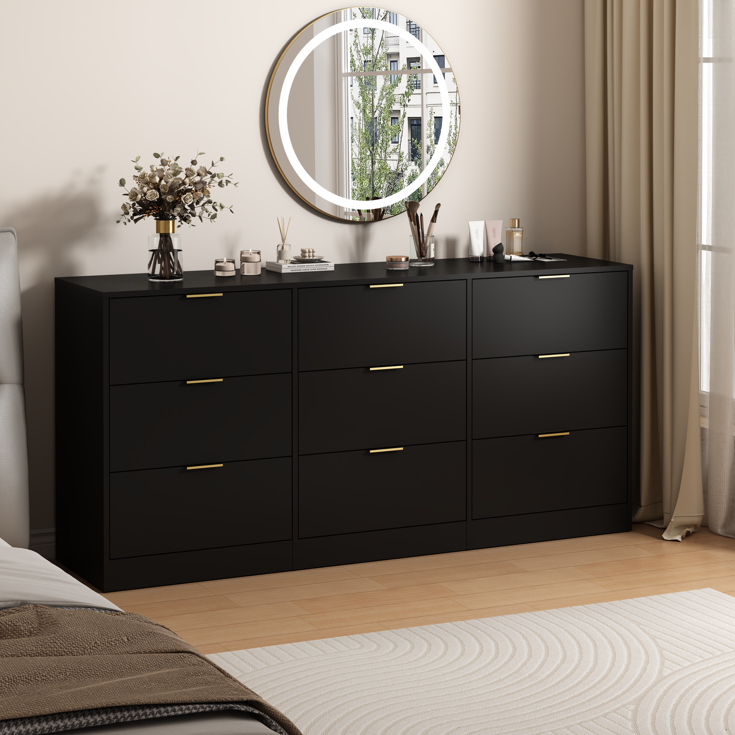 Black dresser with gold handles in a bedroom setting