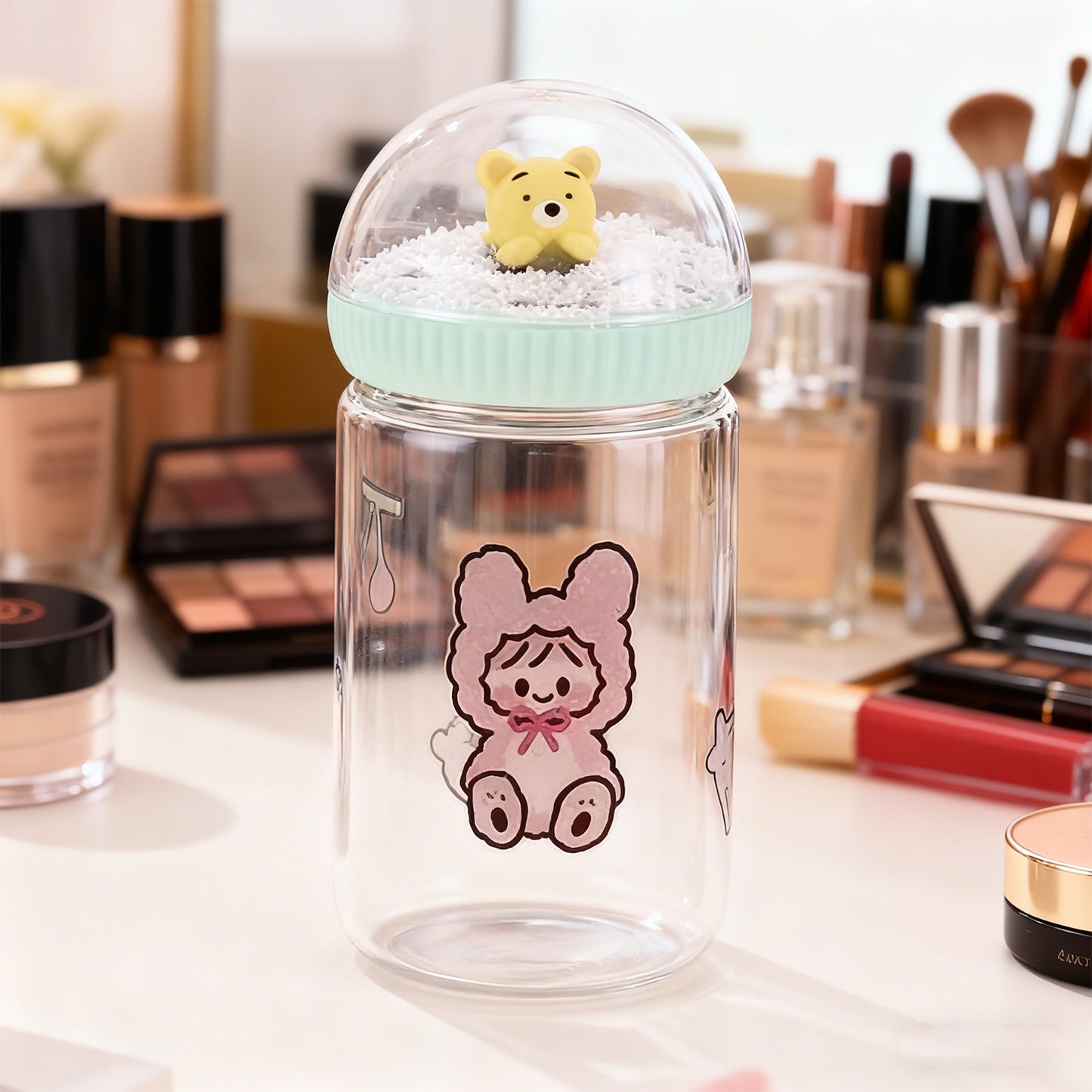 Clear container with cartoon character on a makeup table