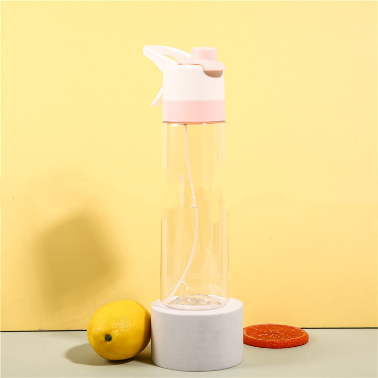 Clear water bottle with pink top and white base on a yellow background