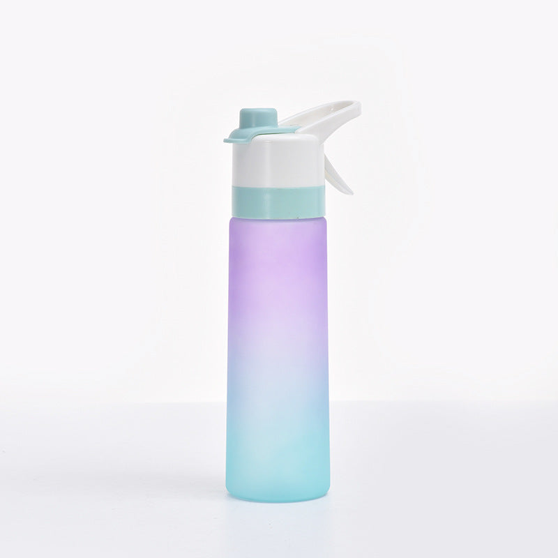 Gradient water bottle with white cap on a light gray background
