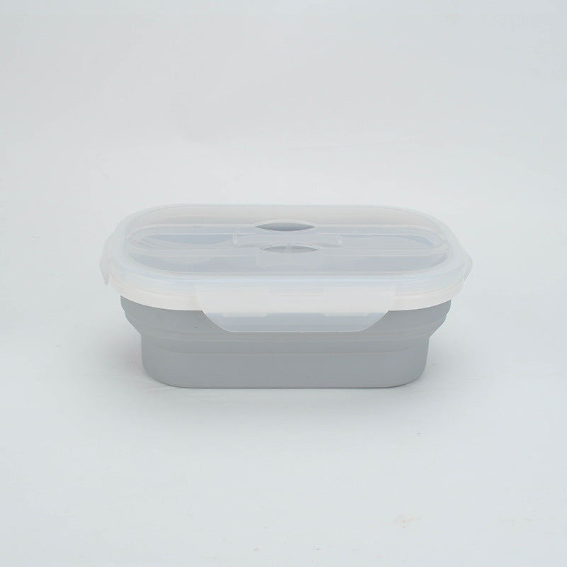 Gray silicone food container with a white lid on a light gray background