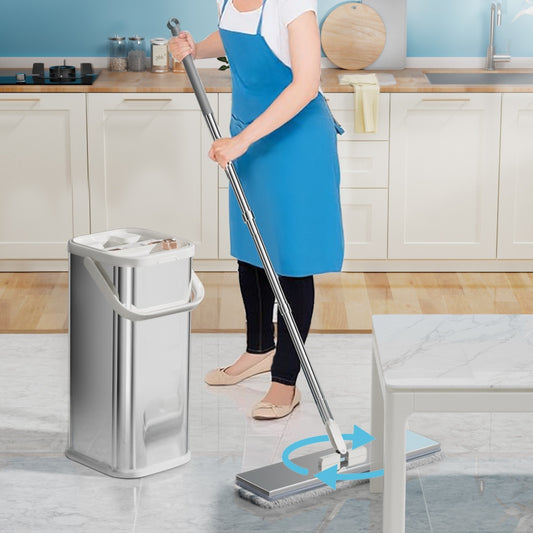 Person cleaning a kitchen floor with a mop and bucket system.