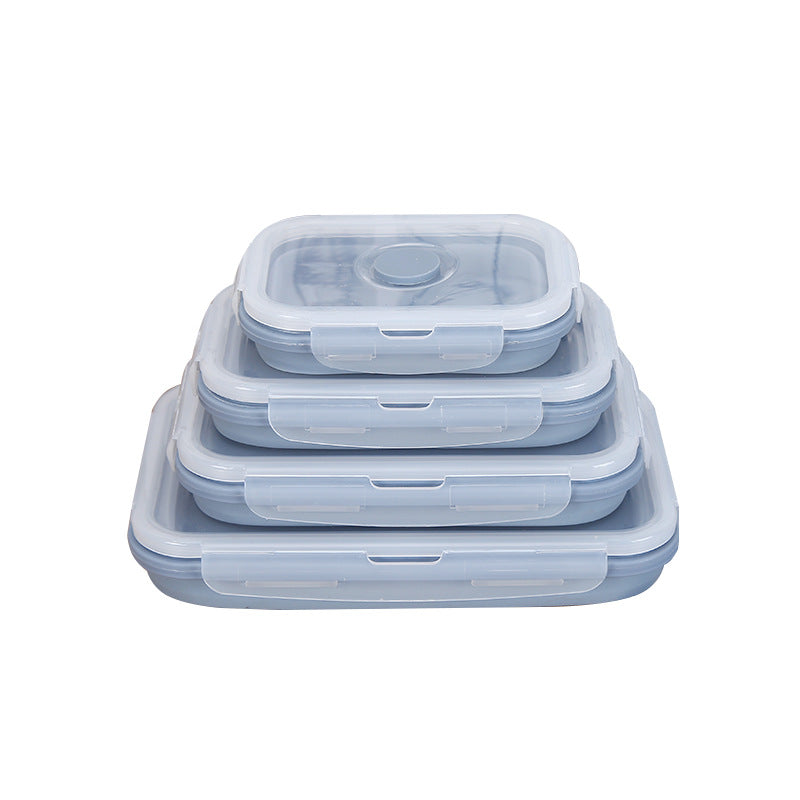 Set of four silicone food storage containers with lids on a white background