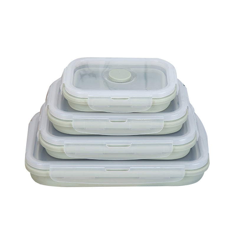Set of three silicone food storage containers with lids on a white background