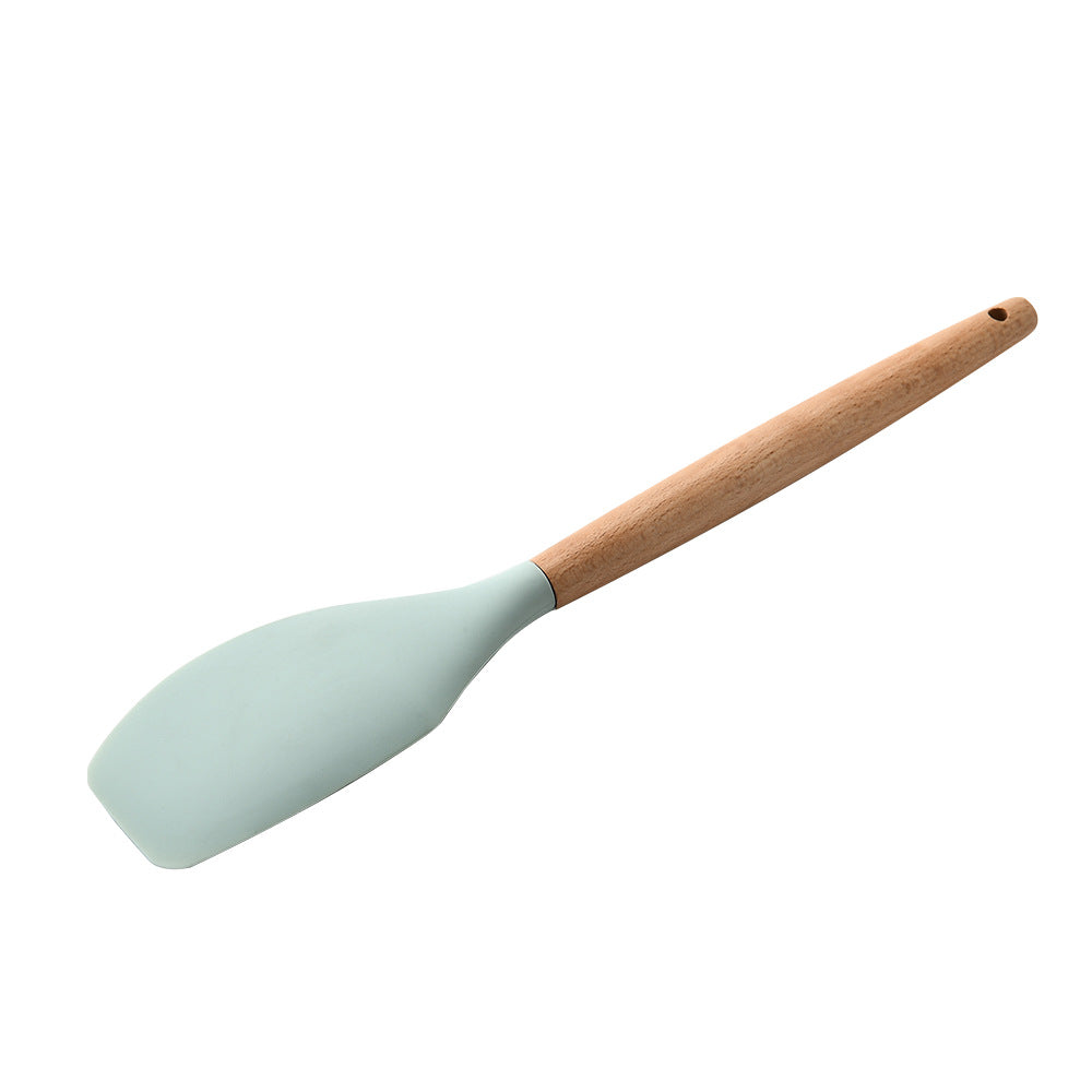 Silicone spatula with a wooden handle on a white background