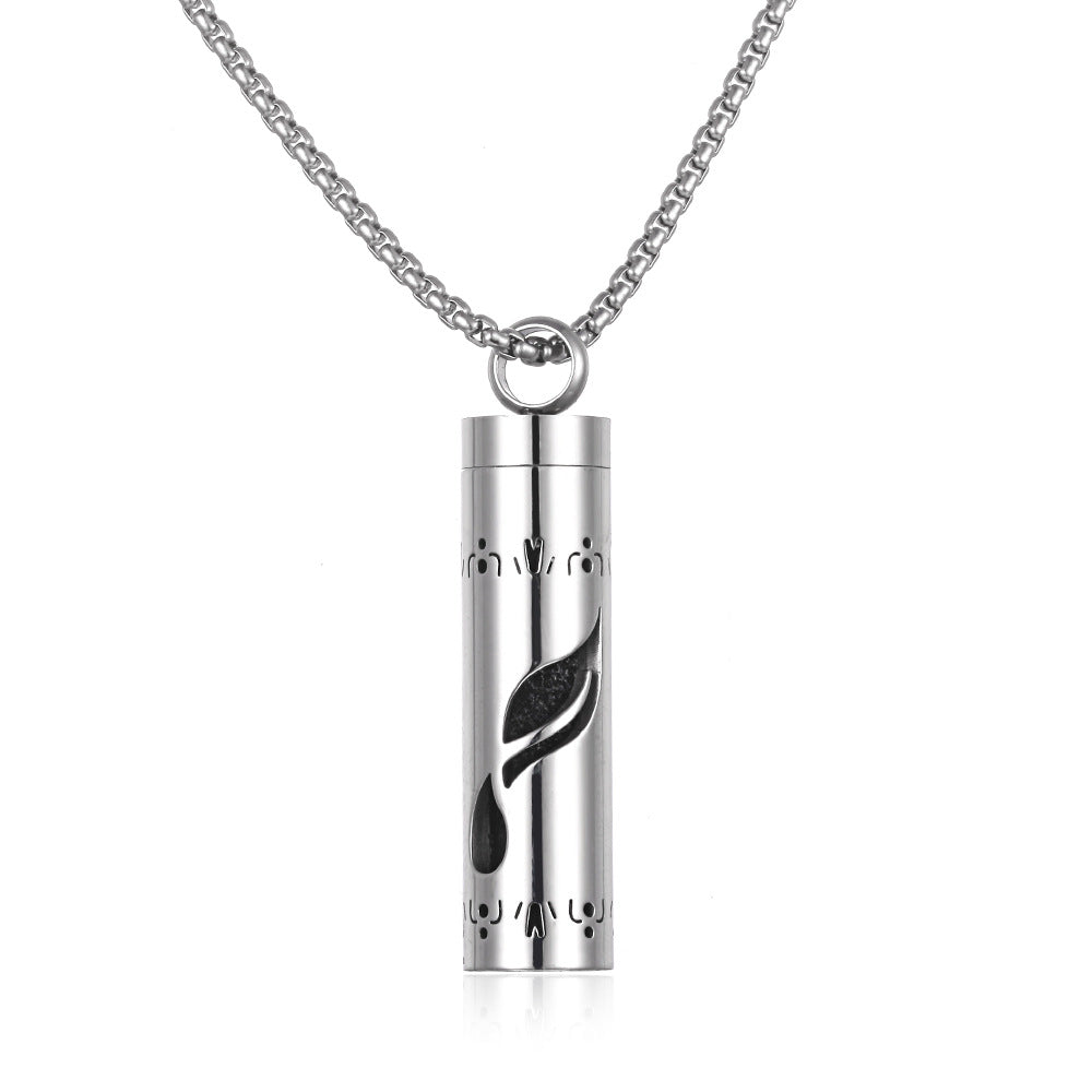 Silver cylindrical pendant with leaf design on a white background