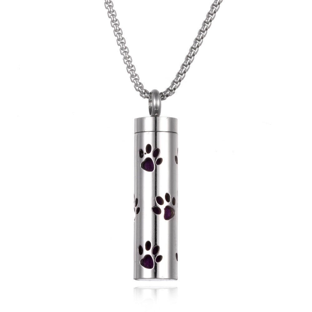 Silver cylindrical pendant with paw prints on a white background