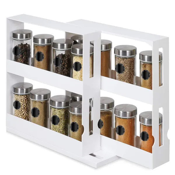 Spice rack with glass jars and metal lids on a white background
