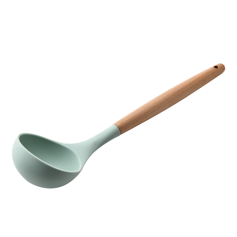 Spoon with a wooden handle on a white background