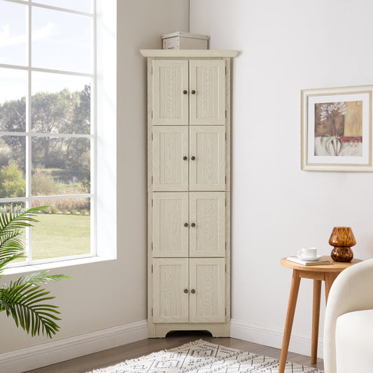 Tall beige pantry cabinet in a room with a window, side table, and plant.