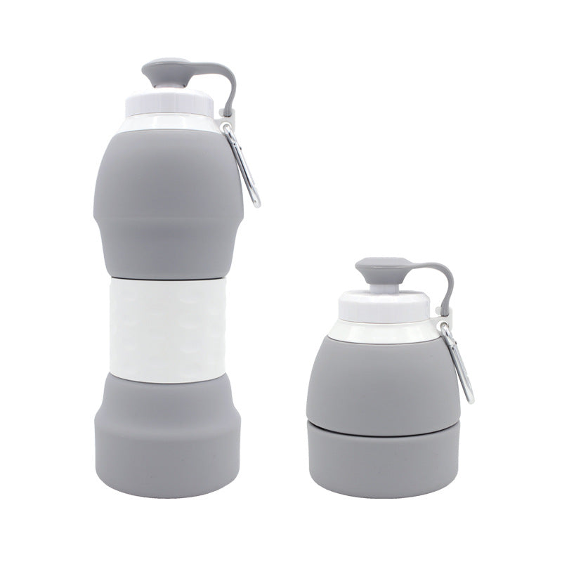 Two gray and white collapsible water bottles on a white background