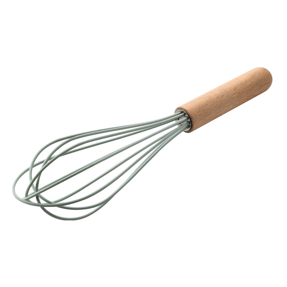 Whisk with wooden handle on a white background