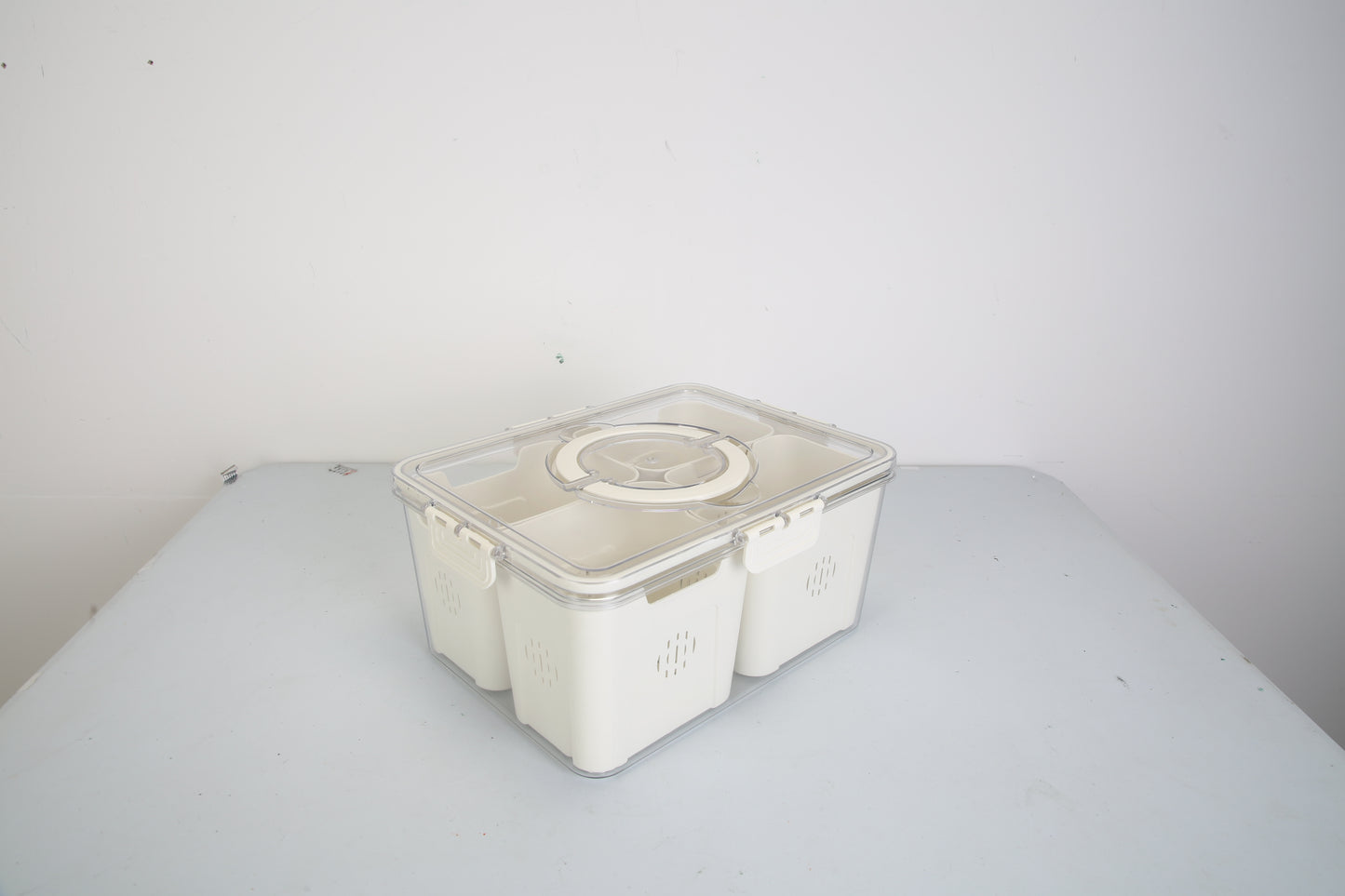 White plastic container with lid on a white surface