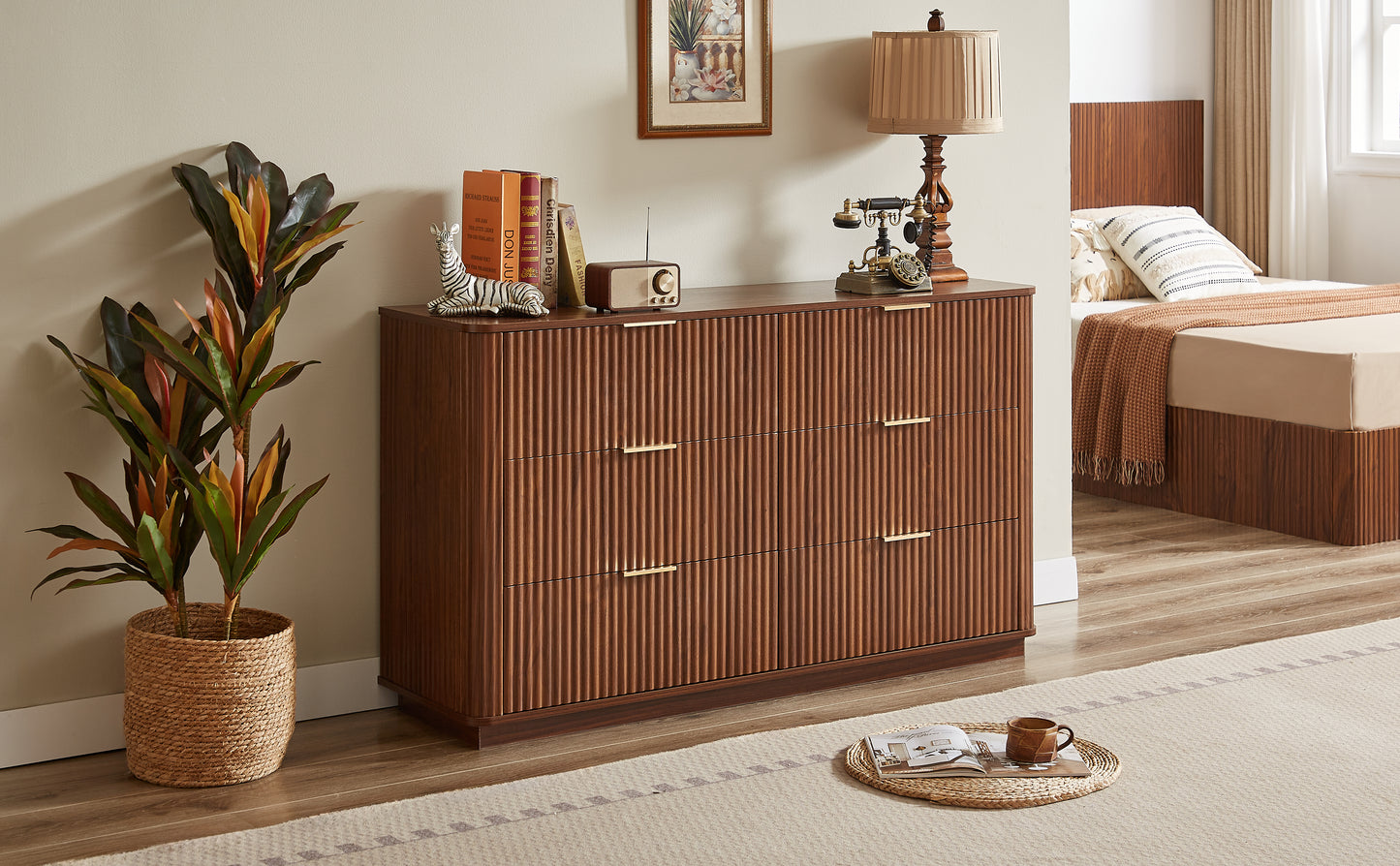 Wooden dresser with decorative items in a bedroom setting