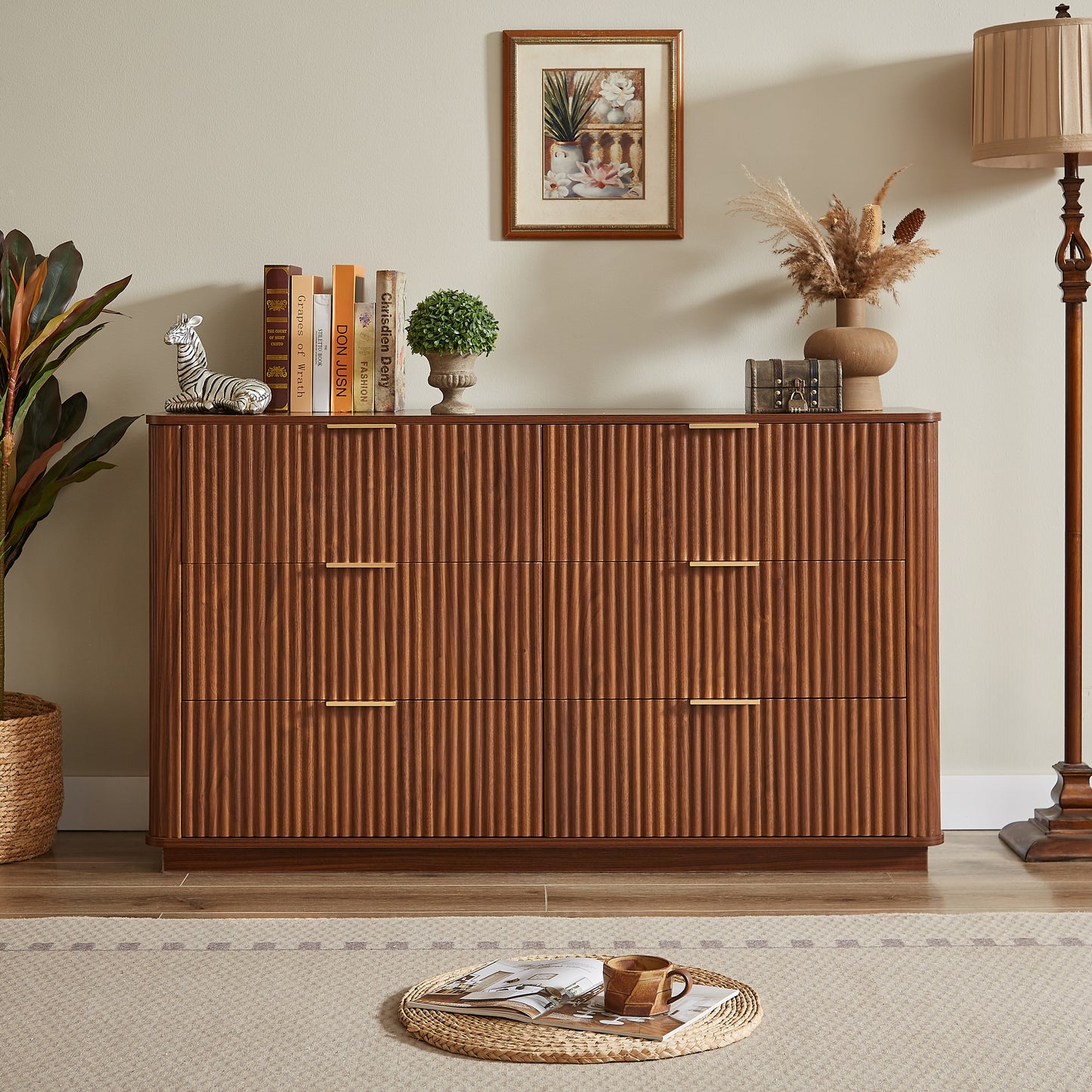 Wooden dresser with decorative items in a room setting