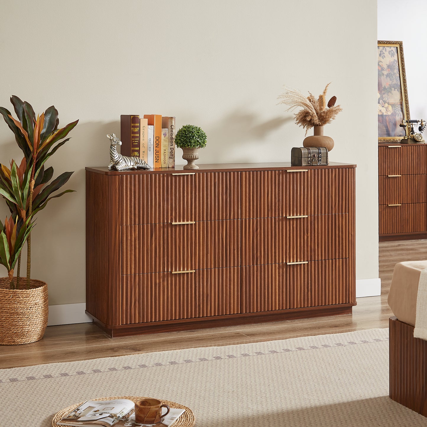 Wooden dresser with decorative items in a room setting